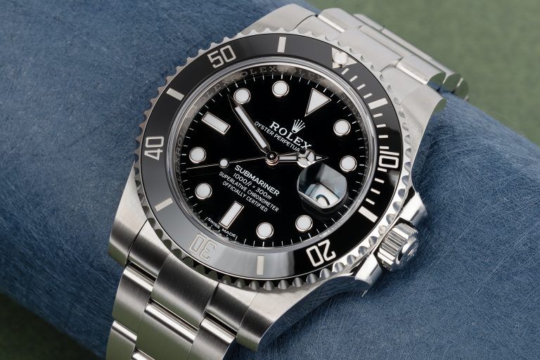 Close-up of a Rolex Submariner stainless steel watch with black dial and bezel