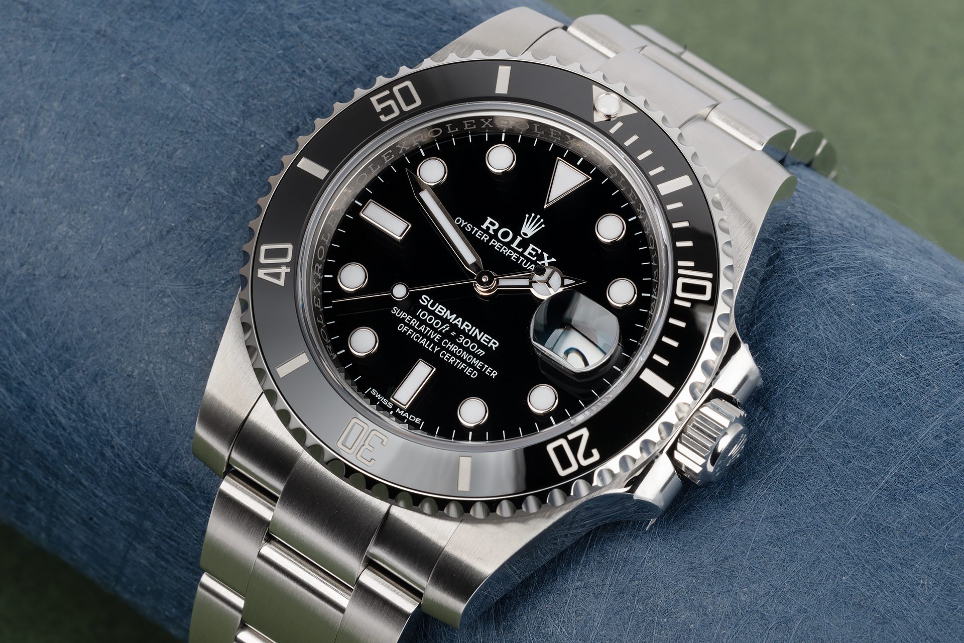 Close-up of a Rolex Submariner stainless steel watch with black dial and bezel