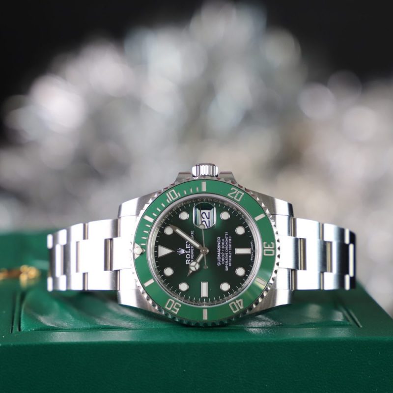 Green Rolex Submariner watch displayed at Ideal Jewelry and Loan pawn shop.