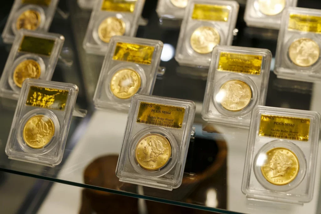Gold bullion coins displayed in protective cases