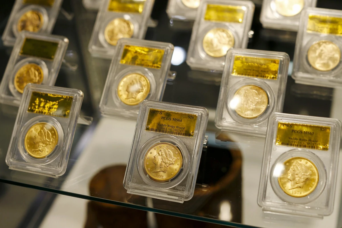 Gold bullion coins displayed in protective cases