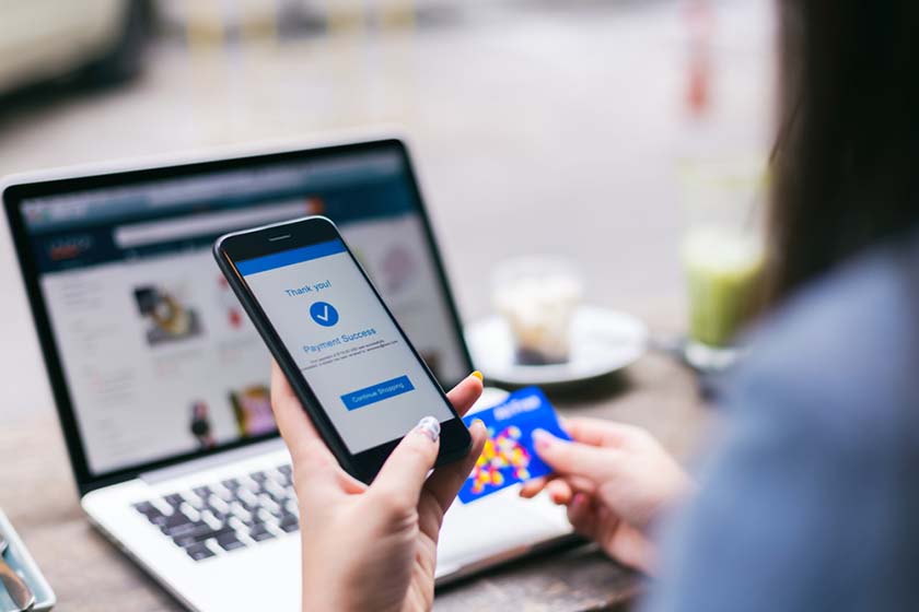 Person browsing pawnshop services online using a laptop or phone