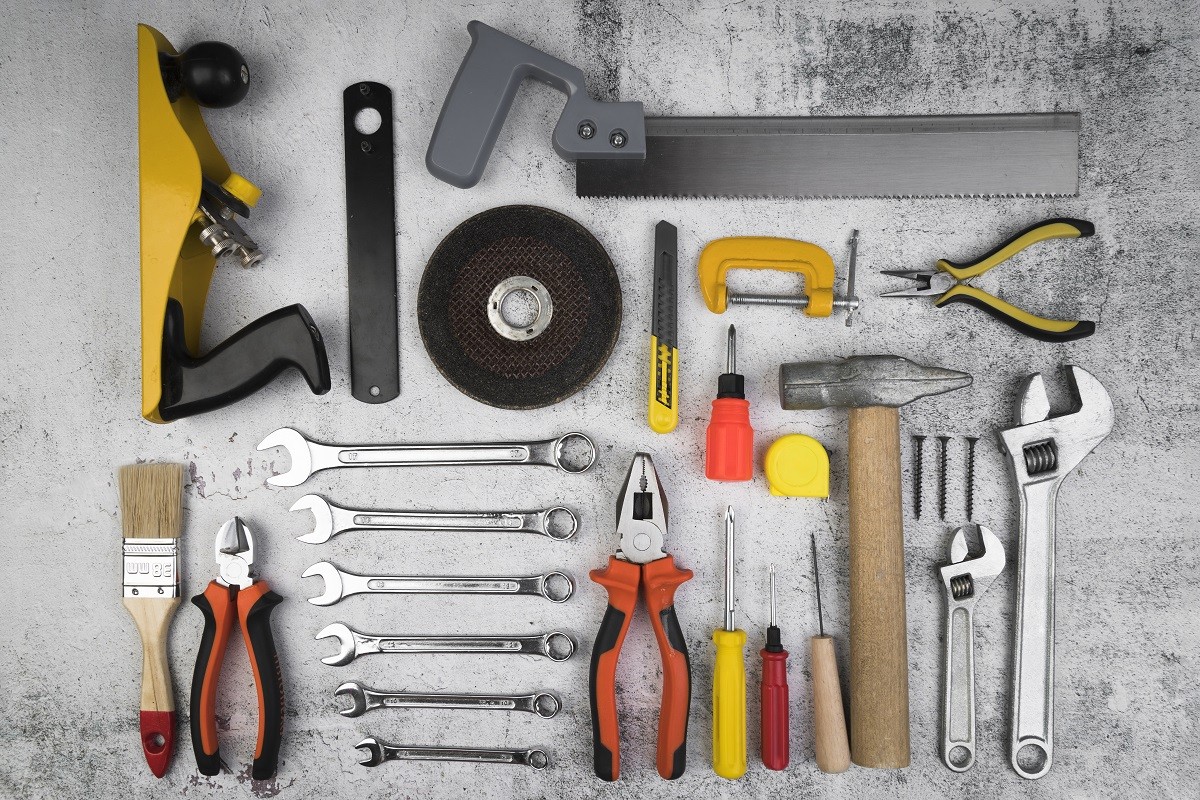 Assorted power tools and hand tools displayed at a local pawn shop