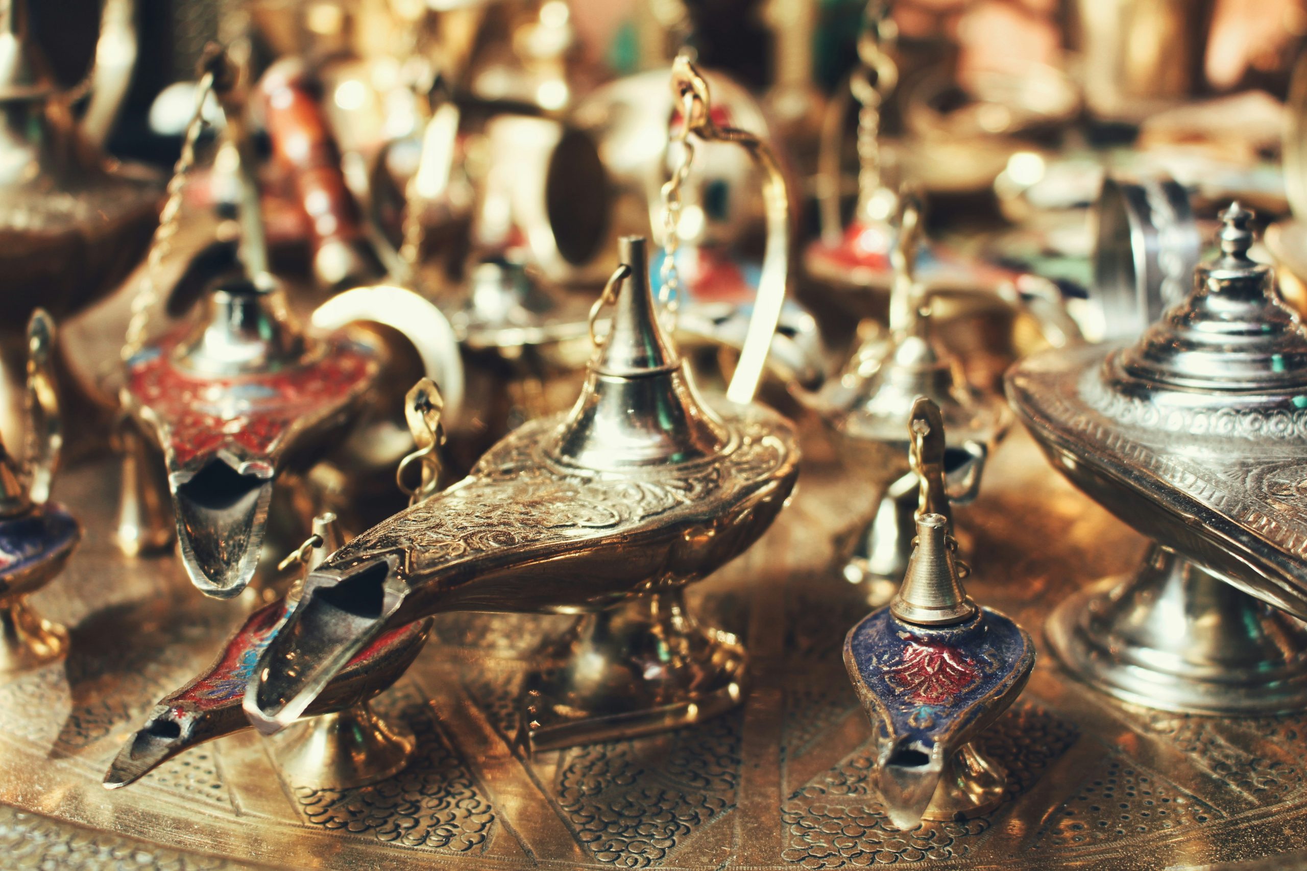 Assorted vintage oil lamps on display symbolizing the history and evolution of pawnshops