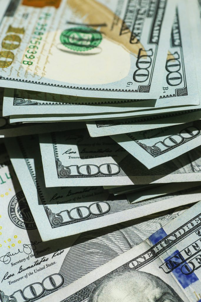 Stack of $100 bills representing fast cash opportunity